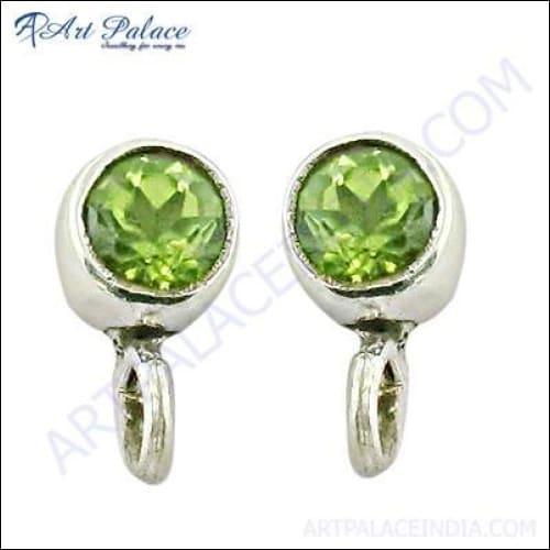 Elegant sterling silver earrings featuring vibrant peridot gemstones, showcasing a stylish and sophisticated design.