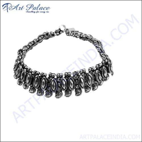 A pair of stylish ethnic design party wear anklets made from German silver, showcasing intricate patterns and a lustrous finish.