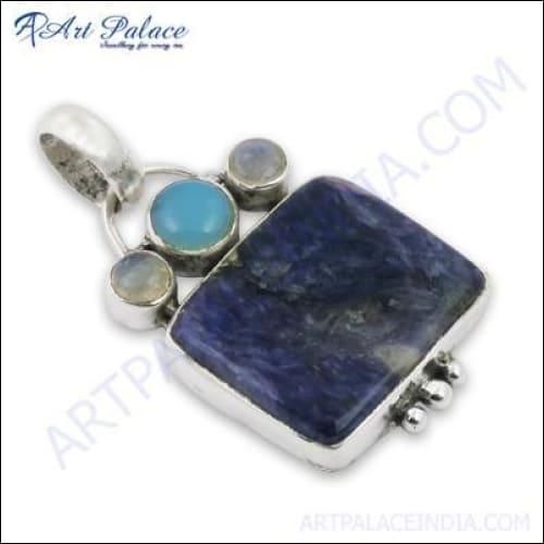 A stunning silver pendant featuring chalcedony, charroite, and rainbow moonstone, showcasing intricate craftsmanship and vibrant colors.