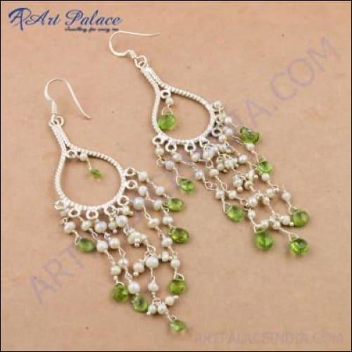 Elegant silver earrings featuring pearl and peridot gemstones with intricate Bali beaded design.