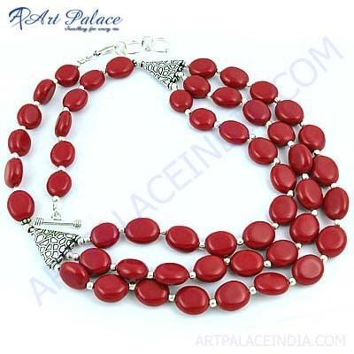 A stunning Feminine Synthetic Coral Gemstone Necklace crafted in German Silver, showcasing intricate design and vibrant coral hues.