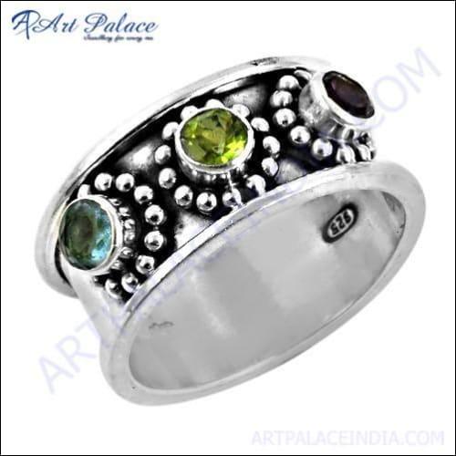 Glamorous silver jewelry featuring amethyst, blue topaz, glass, and peridot gemstones, showcasing intricate design and vibrant colors.