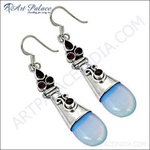 Glamorous silver earrings featuring garnet and synthetic opal gemstones, showcasing intricate craftsmanship and elegant design.