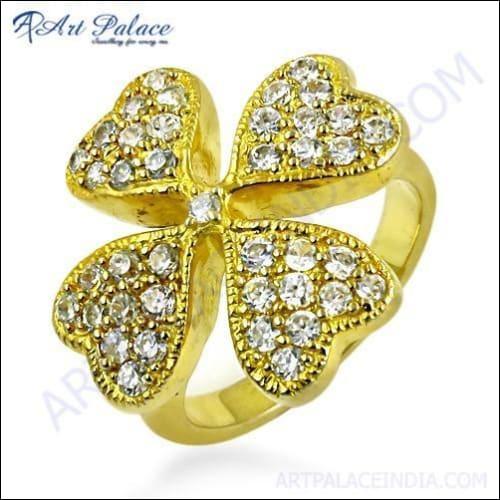 Gold plated silver ring featuring four heart-shaped cubic zirconia gemstones, showcasing elegance and craftsmanship.