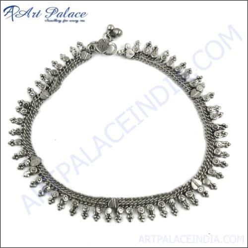 A beautiful handmade silver anklet featuring intricate designs, showcasing elegance and craftsmanship, perfect for women.