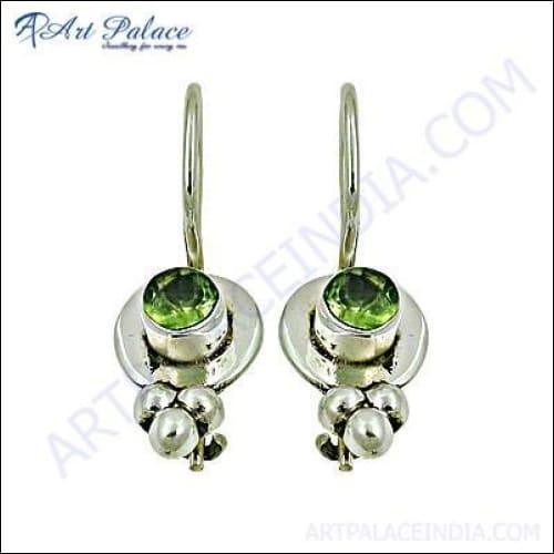 Handcrafted 925 silver earrings featuring vibrant peridot gemstones, showcasing unique design and craftsmanship.