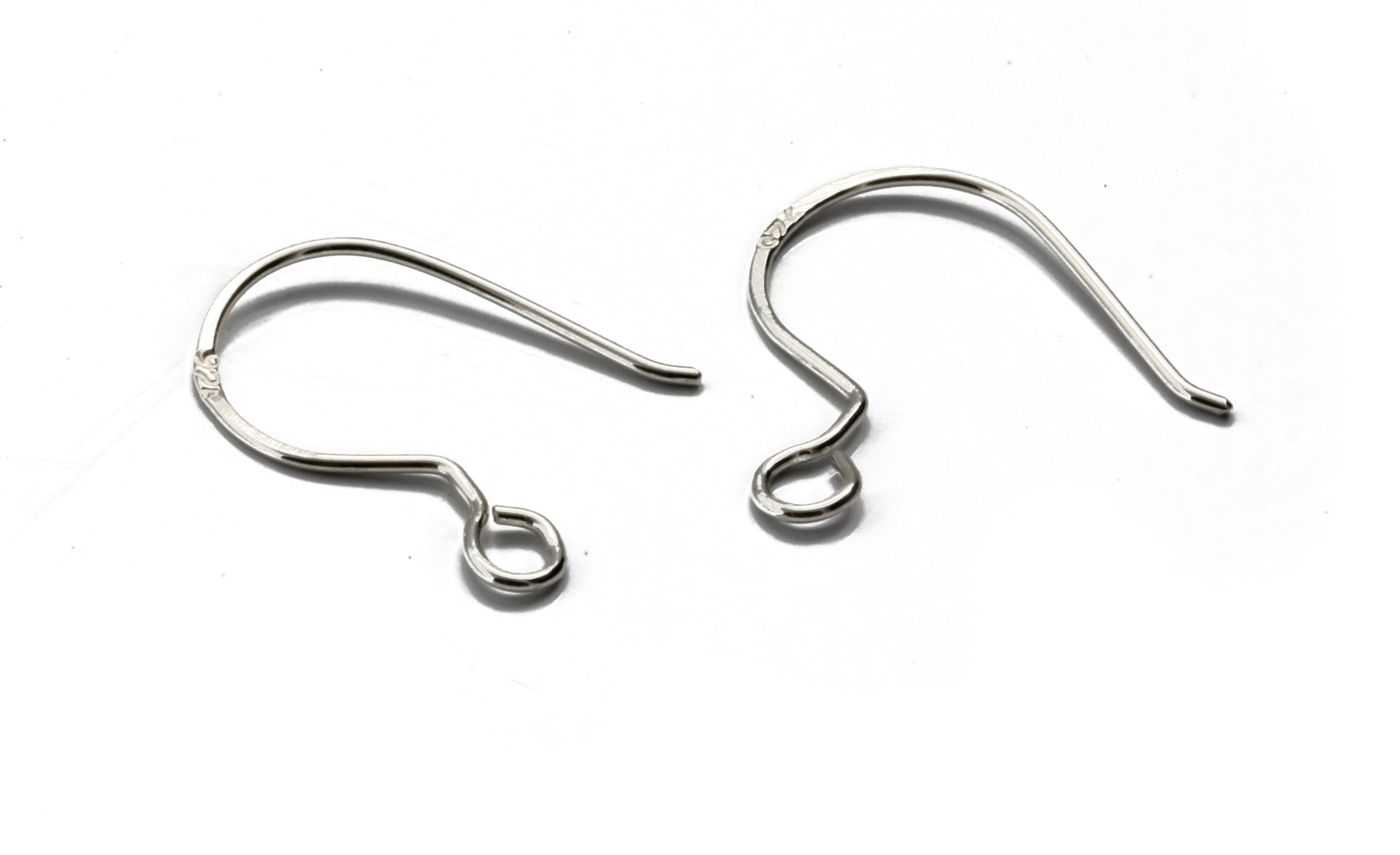 Five pairs of handcrafted fish hook ear wires made from Sterling Silver 925, showcasing their elegant design and quality craftsmanship.