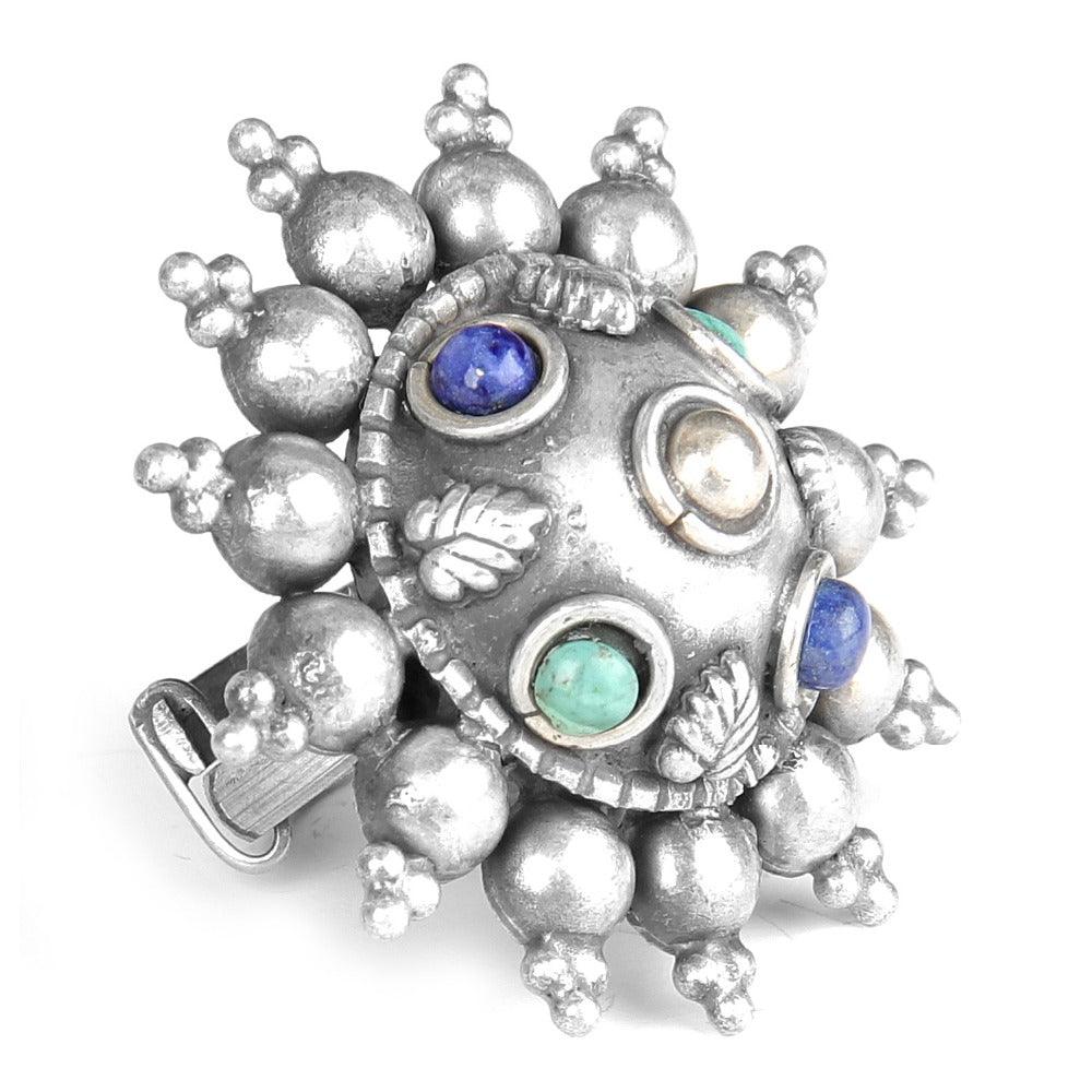 Handcrafted oxidized silver ring featuring lapis lazuli and turquoise gemstones, showcasing intricate design and vibrant colors.