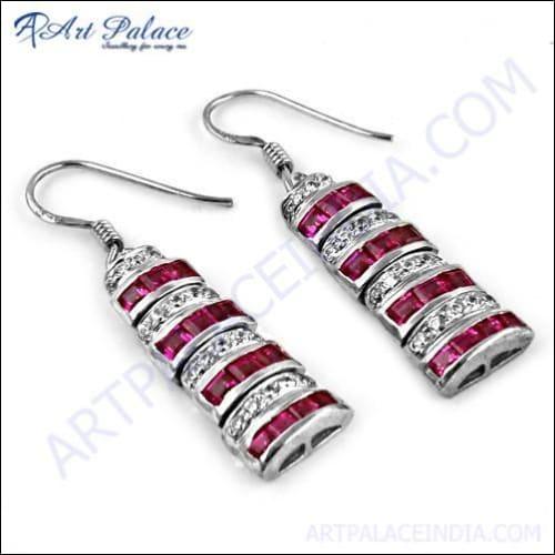 Handcrafted silver earrings featuring pink and white cubic zirconia gemstones, showcasing intricate design and craftsmanship.