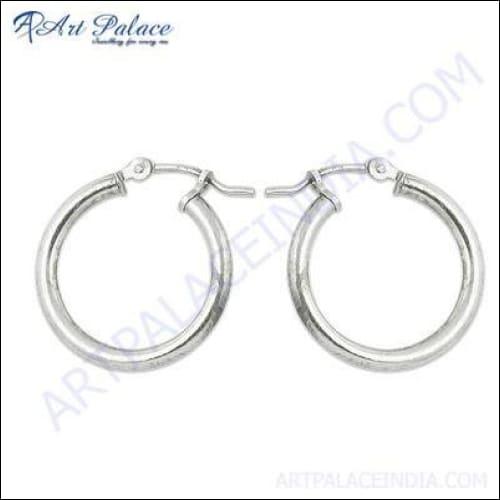 A pair of elegant handcrafted plain silver earrings showcasing minimalist design, perfect for any occasion.