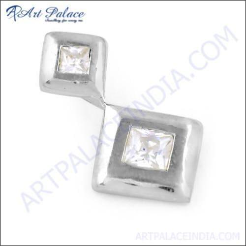 Handcrafted silver pendant featuring a sparkling cubic zirconia gemstone, showcasing intricate design and craftsmanship.