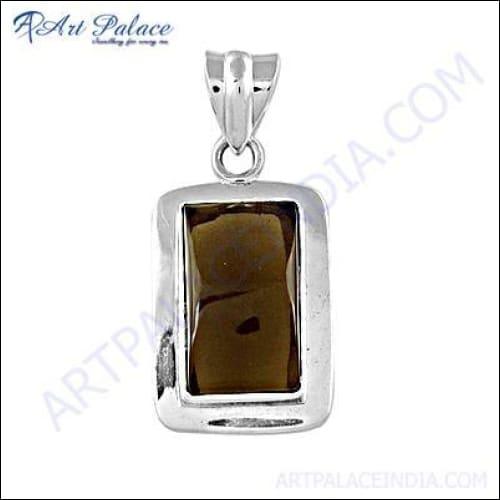 A beautifully handcrafted silver pendant featuring a smokey quartz gemstone, showcasing intricate detailing and elegant design.