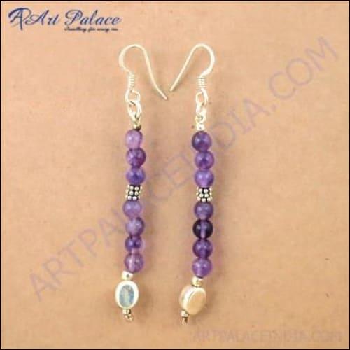 A pair of handmade amethyst beaded earrings showcasing intricate craftsmanship and stunning purple hues, perfect for any occasion.