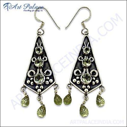 Handmade ethnic silver earrings featuring natural Lemon Quartz stones, showcasing intricate craftsmanship and vibrant design.