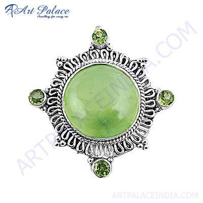 Handmade silver brooch featuring vibrant peridot and calming prehnite gemstones, showcasing exquisite craftsmanship and elegant design.