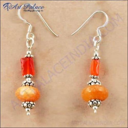 Handmade silver earrings featuring vibrant Carnelian and Yellow Aventurine stones, showcasing intricate craftsmanship and elegant design.