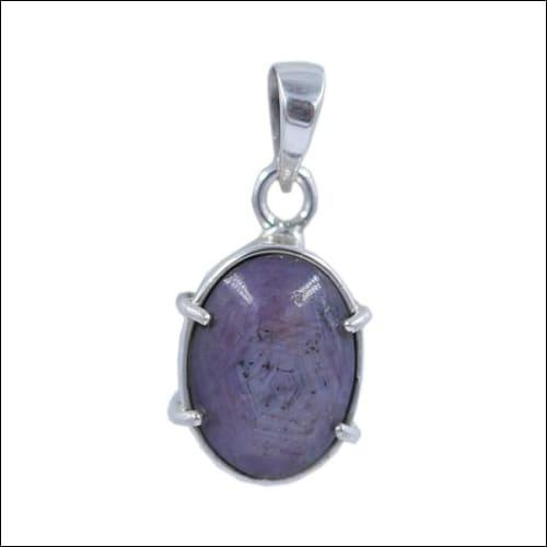 Handmade Star Ruby Stone Pendant set in 925 Silver, showcasing a beautiful star ruby with a polished silver frame.