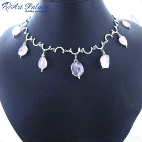 A beautiful rose quartz gemstone necklace set in 925 sterling silver, showcasing its elegant design and soft pink hue.