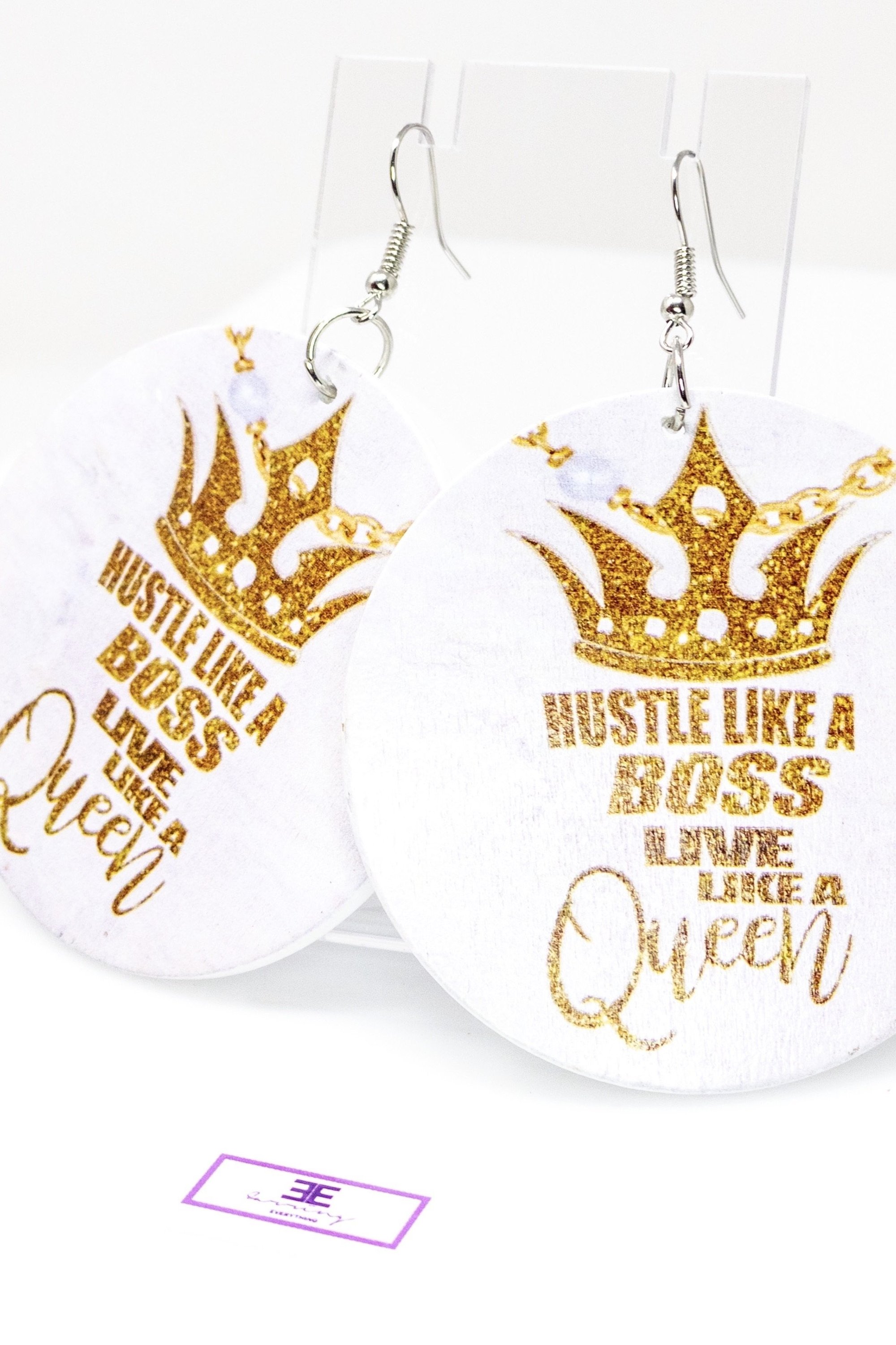 A pair of stylish Boss Queen Hoop Drop Earrings made from wood, featuring a round design in white and brown colors, with nickel-free brass ear hooks.