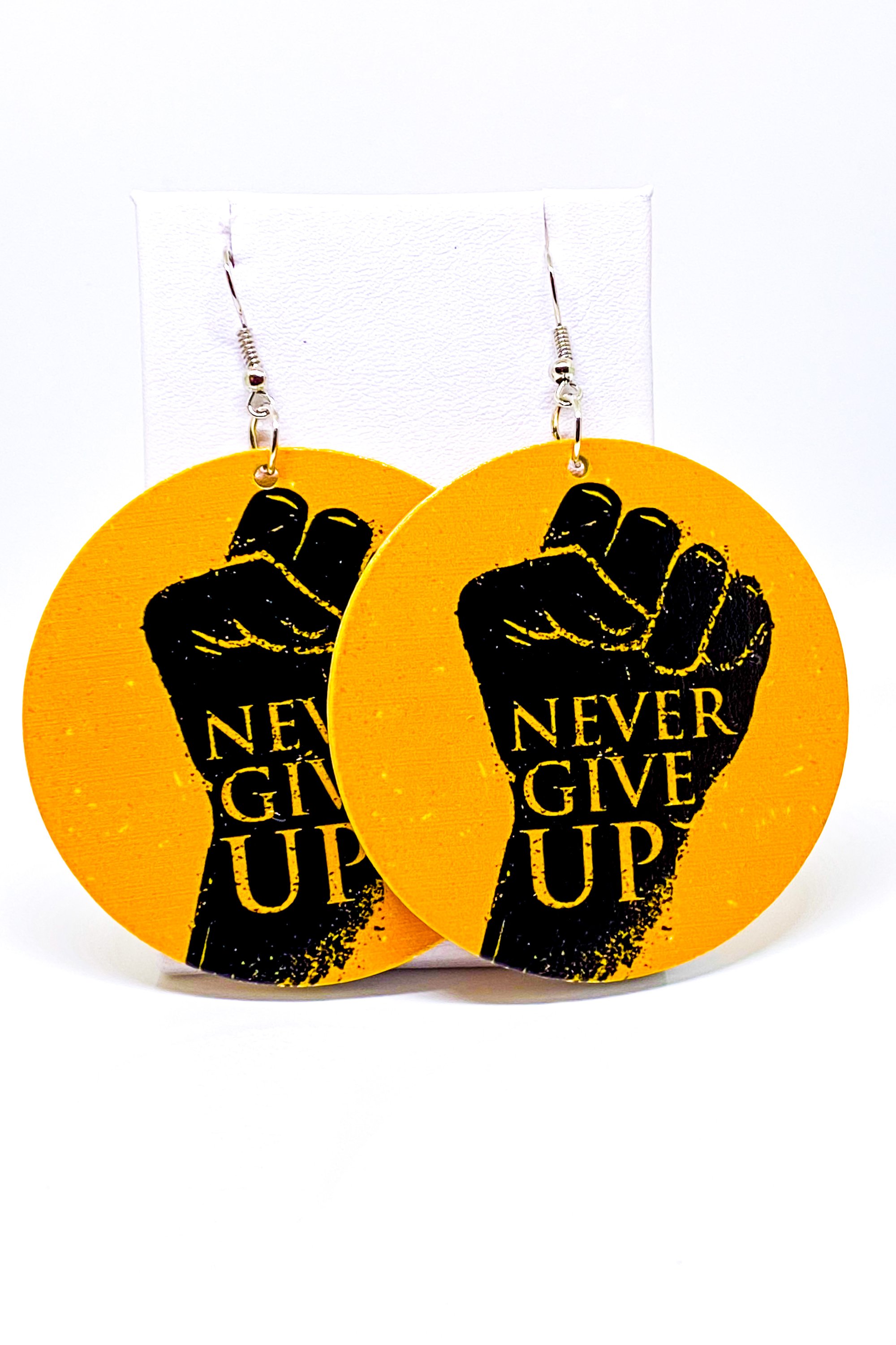 A pair of vibrant yellow wooden hoop earrings, showcasing a round design with a 2.25 inch diameter, perfect for casual and cultural styles.