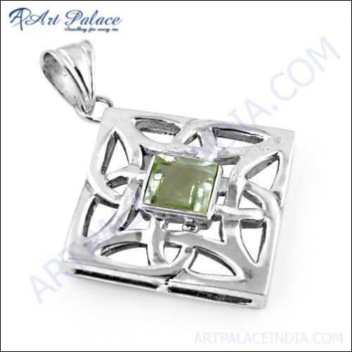 Handcrafted Indian silver pendant featuring a green amethyst gemstone with intricate fretwork design.