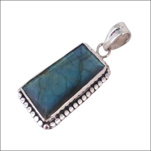 A stunning Labradorite gemstone set in a 925 silver pendant, showcasing its unique color play and elegant design.