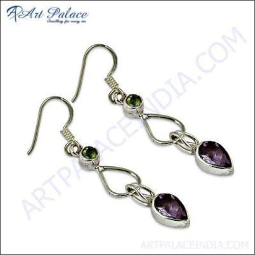 A pair of elegant silver earrings featuring amethyst and peridot gemstones, showcasing their vibrant colors and intricate design.