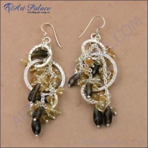Antique style silver earrings featuring citrine and smokey quartz gemstones, showcasing intricate craftsmanship.