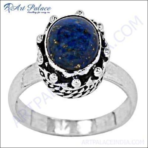 A stylish 925 sterling silver ring featuring a deep blue lapis lazuli gemstone, showcasing intricate craftsmanship and modern design.