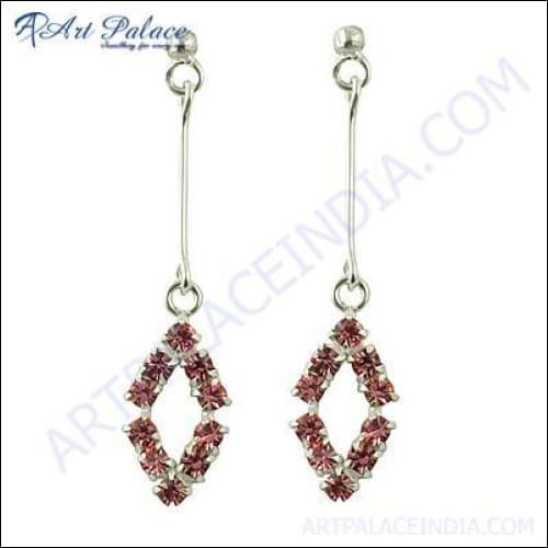 Luxurious pink cubic zirconia gemstone silver earrings showcasing intricate design and sparkling stones.
