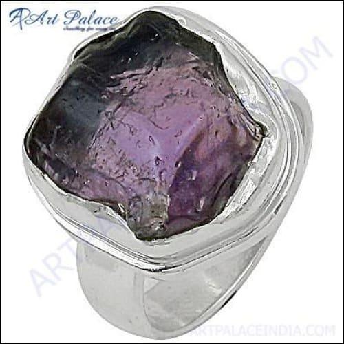 A luxurious silver ring featuring a stunning amethyst gemstone, perfect for party wear, showcasing intricate design and fine craftsmanship.