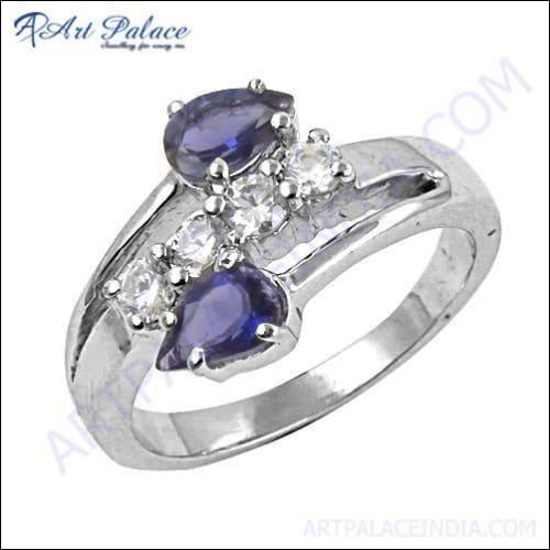 A luxurious silver ring featuring a vibrant iolite gemstone surrounded by sparkling cubic zirconia, showcasing elegant craftsmanship.