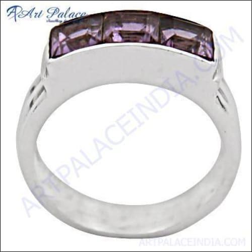 A beautiful three stone amethyst silver ring and matching earrings, showcasing rich purple gemstones set in elegant silver.