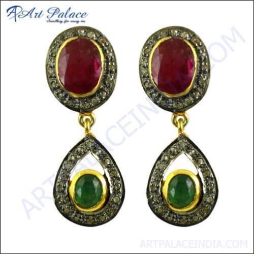 A pair of elegant Victorian earrings featuring diamonds, emeralds, rubies, and gold-plated silver, showcasing intricate craftsmanship.