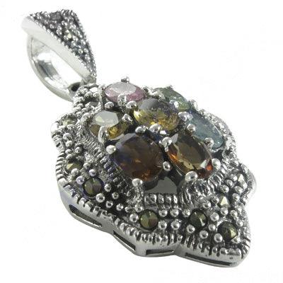 A beautiful silver pendant featuring marcasite and tourmaline gemstones, showcasing intricate craftsmanship and elegant design.