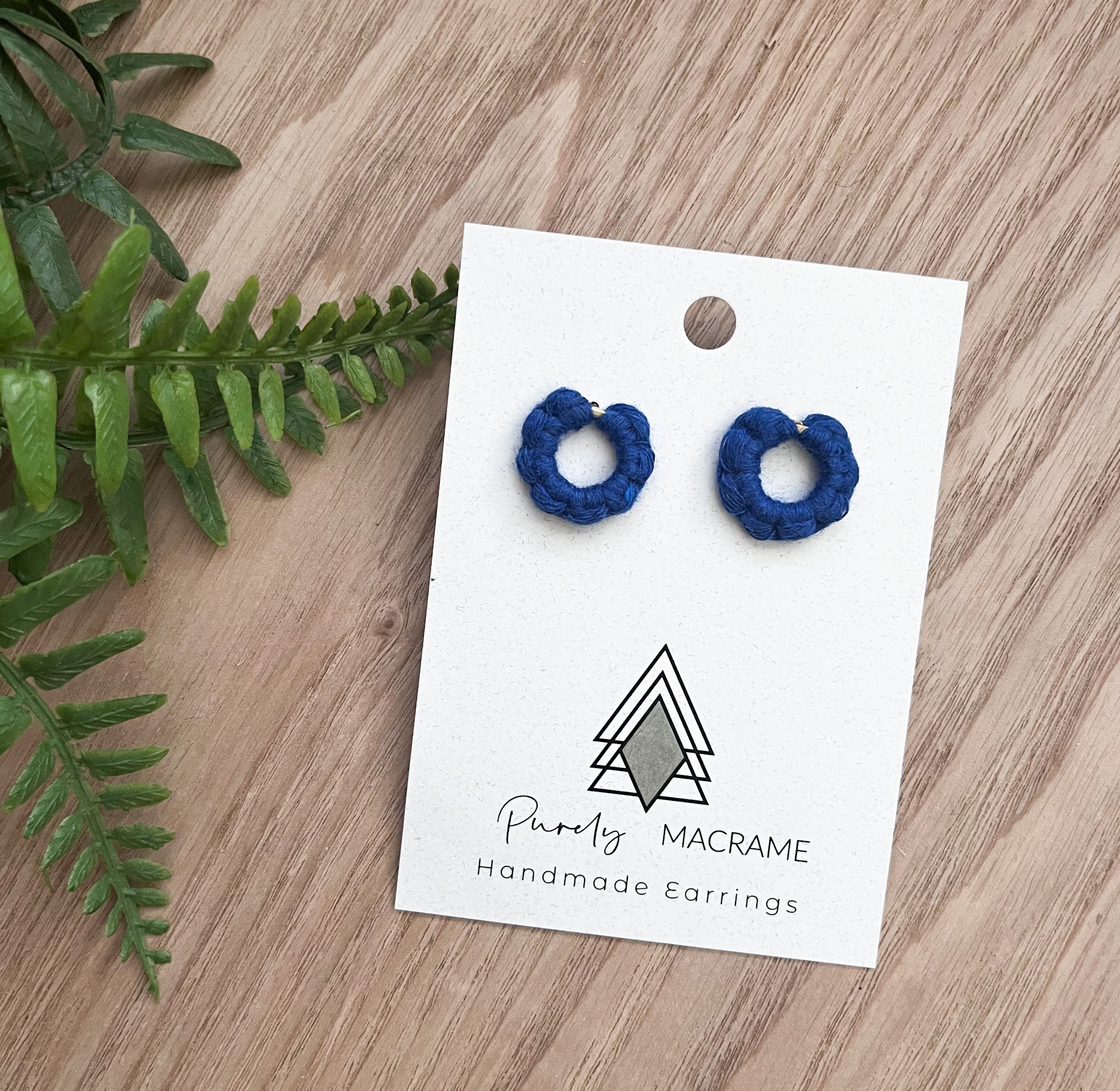 A pair of handmade Mini Circle Studs made from 100% macrame cotton, featuring a lightweight and stylish design, perfect for sensitive ears.