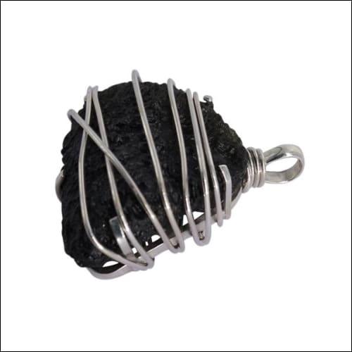 Handmade 925 silver pendant featuring a stunning Moldavite stone, showcasing its unique green color and artisan craftsmanship.