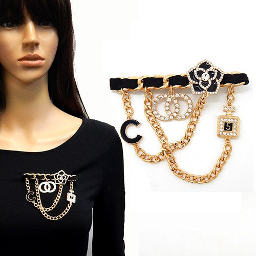 Multi Charm Dangling Brooch featuring various charms, elegantly designed for fashion enthusiasts.