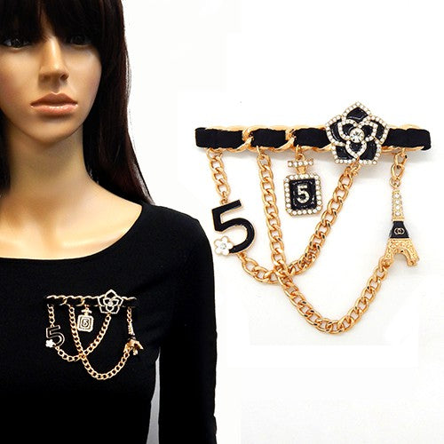 Multi Charm Dangling Brooch featuring various charms, elegantly designed for fashion enthusiasts.