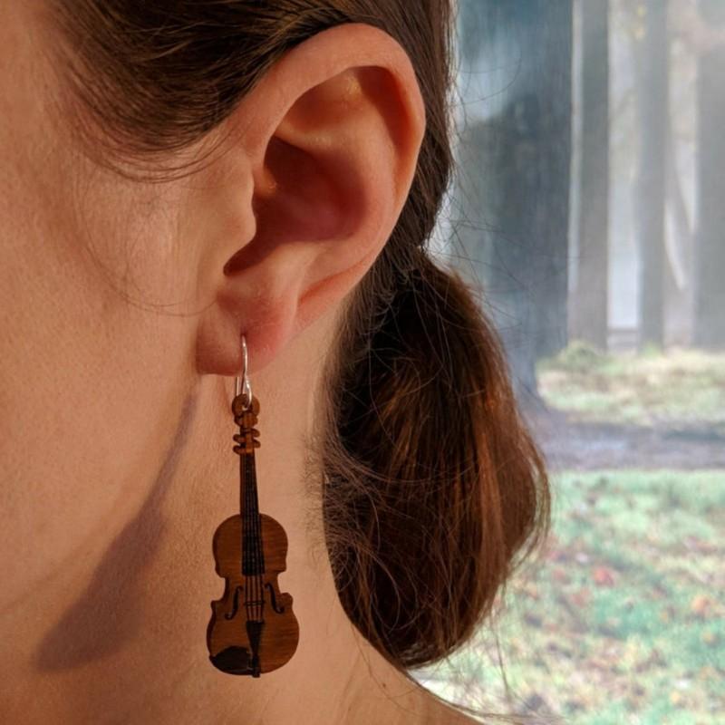 A pair of lightweight wooden earrings shaped like musical instruments, featuring sterling silver ear wires, beautifully crafted from Birchwood.