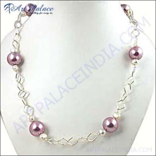 A beautiful handcrafted necklace featuring pink and white freshwater pearls, elegantly strung together with silver accents.