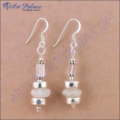 Elegant silver earrings featuring crystal rainbow moonstone, perfect for party wear, showcasing a unique design with iridescent colors.