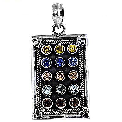 Colorful multi-gemstone pendant with ethnic design, showcasing vibrant stones and intricate craftsmanship.
