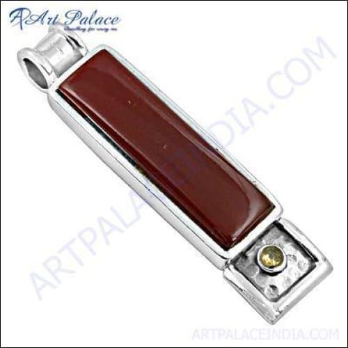 Elegant long pendant necklace featuring red onyx and citrine gemstones set in silver, showcasing intricate craftsmanship.