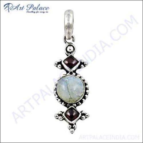 A beautiful silver pendant featuring garnet and rainbow moonstone, showcasing intricate craftsmanship and elegant design.