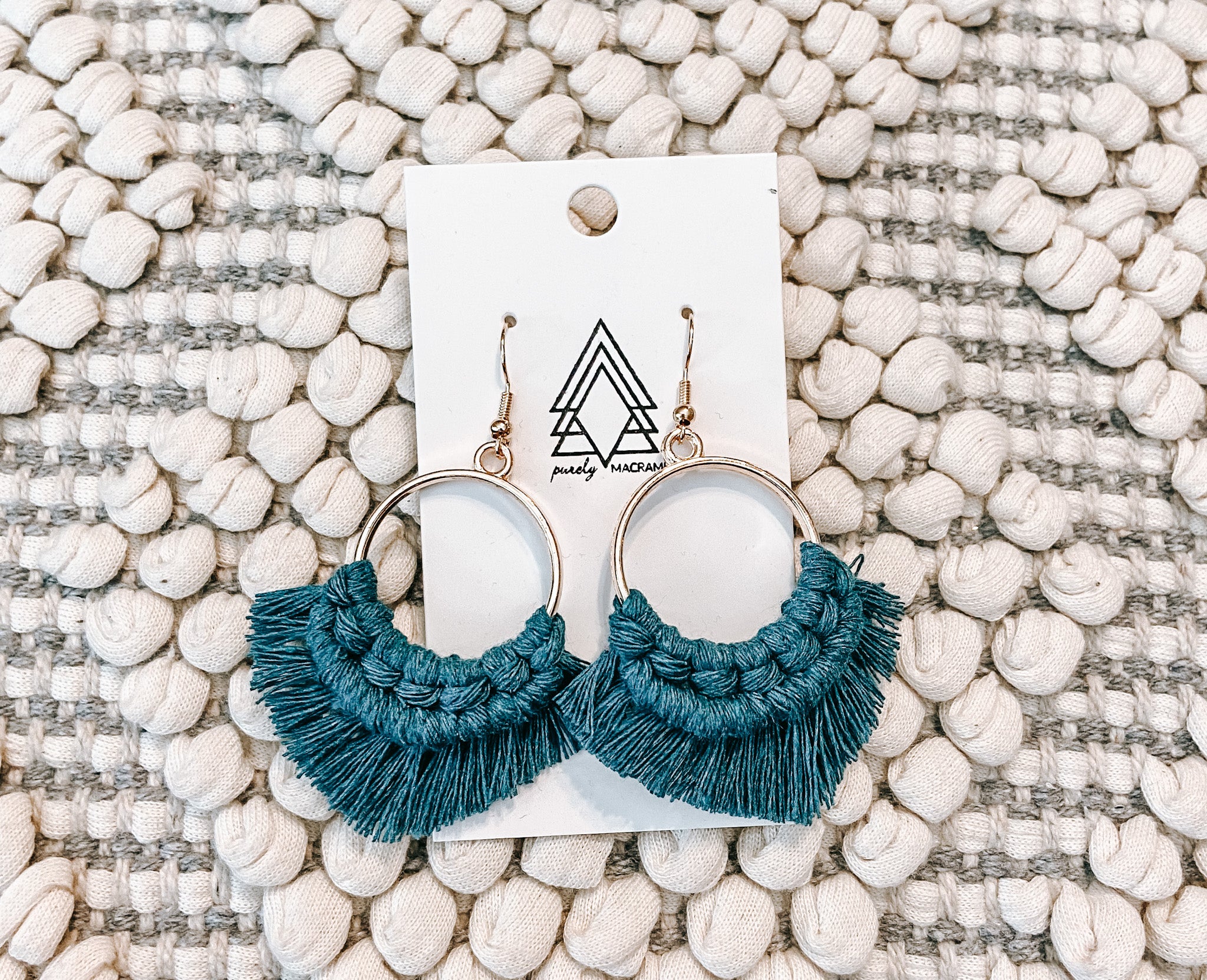 Elegant Peacock Golds earrings made from 100% macrame cotton, showcasing intricate design and lightweight structure.