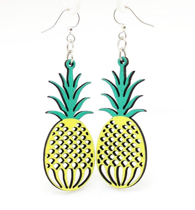 A pair of laser-cut wooden pineapple earrings with silver-finished stainless steel ear wires, showcasing intricate details and a natural wood back.