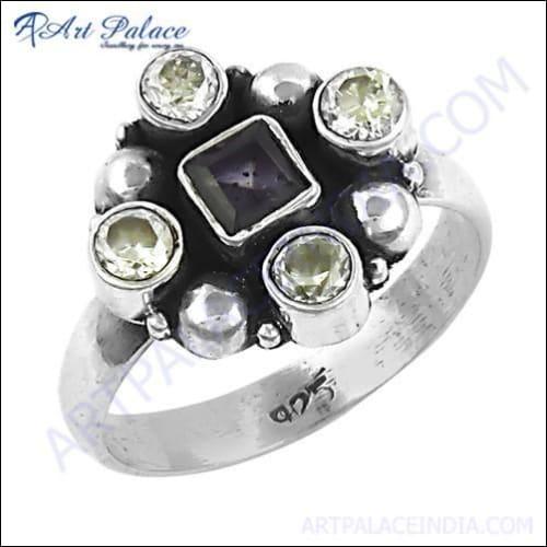 A beautiful 925 sterling silver ring featuring a vibrant iolite gemstone surrounded by sparkling cubic zirconia, showcasing elegant craftsmanship.