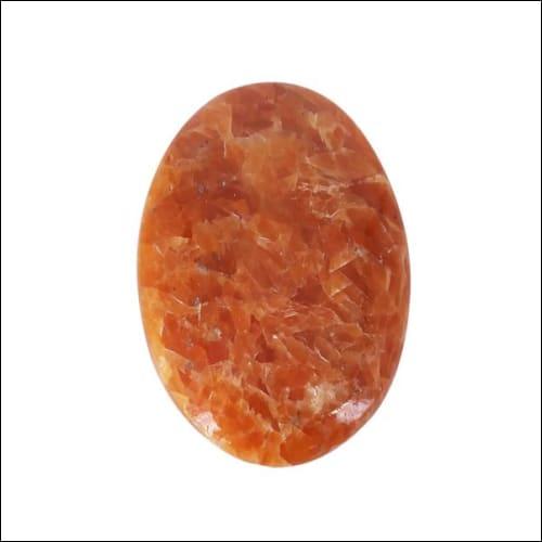 Chunky Positive Energy Orange Calcite Stone with vibrant orange hues, perfect for healing and meditation.