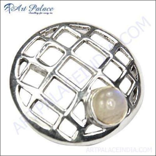 Rainbow Moonstone Round Silver Pendant featuring intricate fretwork design, showcasing a shimmering gemstone in a stylish silver setting.